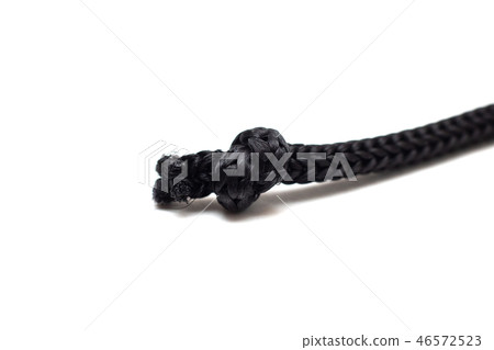 Knot on black rope close up on white background 46572523