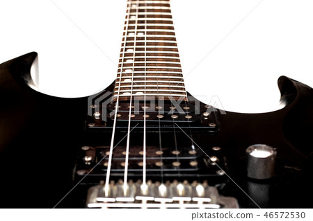Wooden neck of a black guitar close up Wooden neck of a black guitar close up 46572530