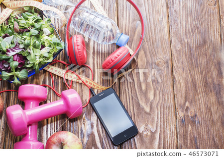 Fresh organic vegetables with dumbbells Fresh organic vegetables with dumbbells 46573071
