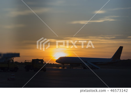 Colorful of sunset in the airport with aeroplane Colorful of sunset in the airport with aeroplane 46573142