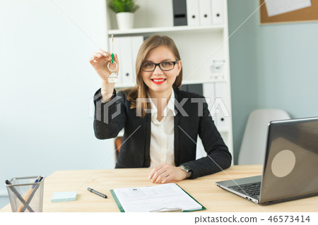 New home and real estate concept - Happy realtor woman giving you keys New home and real estate concept - Happy realtor woman giving you keys 46573414