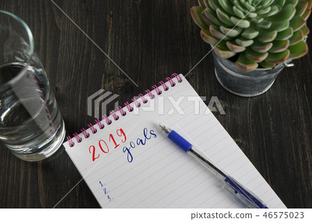 Top view of notebook with text 2019 goals Top view of notebook with text 2019 goals 46575023
