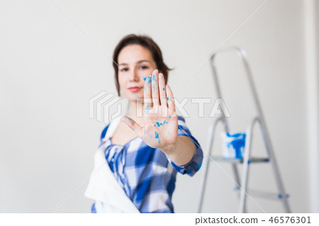 People, renovation and apartment concept - Close up portrait of attractive young woman with painted People, renovation and apartment concept - Close up portrait of attractive young woman with painted 46576301