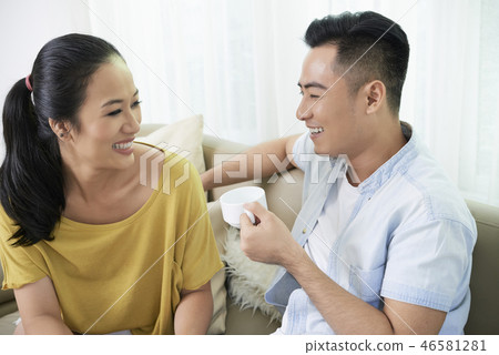 Laughing couple with coffee 46581281