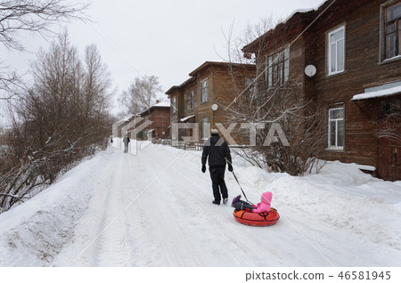 Snowy street in old russian town 46581945