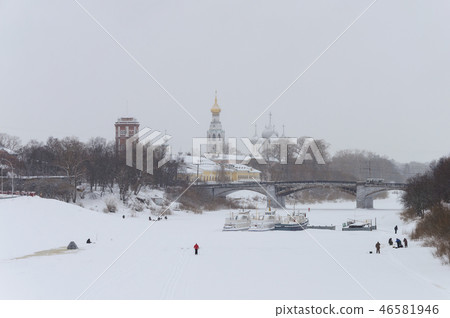 Fishing people on frozen river in Vologda, Russia Fishing people on frozen river in Vologda, Russia 46581946