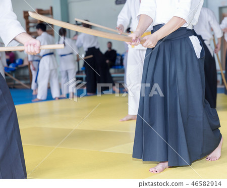 People in kimono on martial arts weapon training seminar People in kimono on martial arts weapon training seminar 46582914