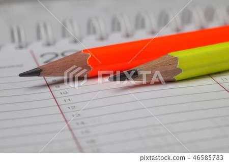 Pencils laying on spiral notebook Pencils laying on spiral notebook 46585783