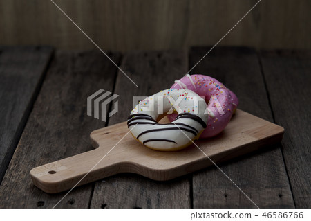 Glazed mini donuts on wooden background 46586766
