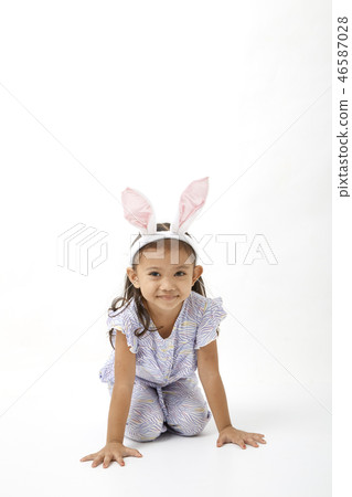 Girl acting as a little easter day 46587028