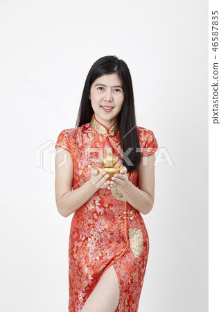 Chinese New Year, business woman holding gold Chinese New Year, business woman holding gold 46587835