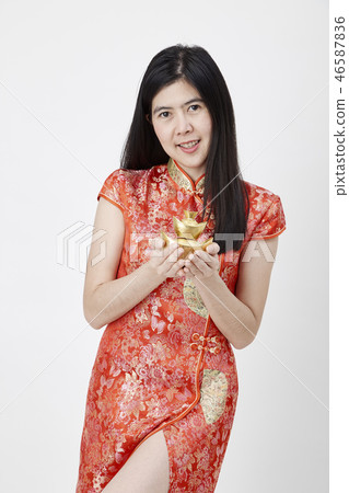 Chinese New Year, business woman holding gold  46587836