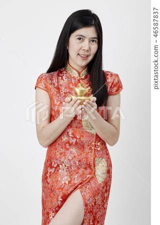 Chinese New Year, business woman holding gold  46587837