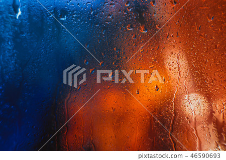 Drops of rain on the window of the car in the evening 46590693