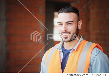 Young Construction Worker Smiling At Camera In New Building 46592161