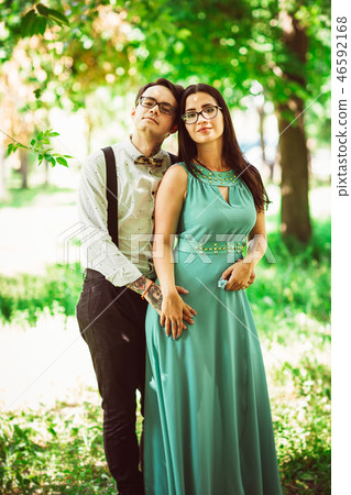 Beautiful young couple on the park background Beautiful young couple on the park background 46592168