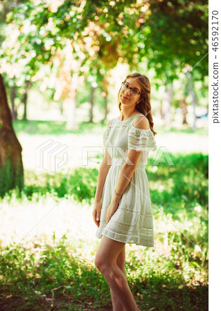 Beautiful young girl on natural background Beautiful young girl on natural background 46592170