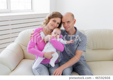 Childgood, parenthood, people concept - baby on the hands of parents on a white background. 46592608