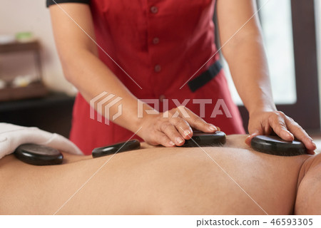 Hot stone massage therapy 46593305