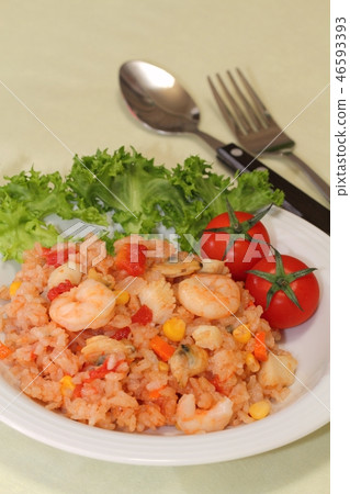Cooked rice with tomato and seafood Cooked rice with tomato and seafood 46593393