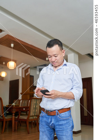 Man using his smartphone 46593455