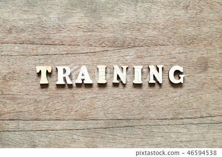 Letter block in word training on wood background Letter block in word training on wood background 46594538