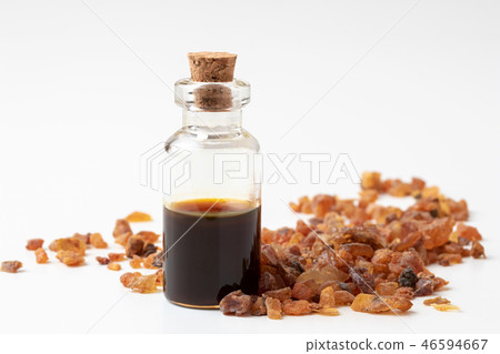 A bottle of myrrh essential oil with myrrh resin 46594667