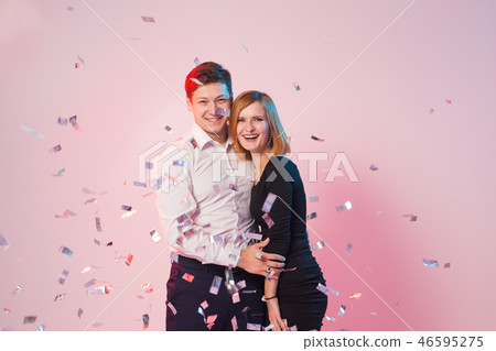 New Year, Saint Valentine's day and holidays concept - Cheerful joyful young people standing and 46595275