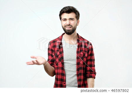 Spanish angry and discontented man spreading his hand and ask what do you mean Spanish angry and discontented man spreading his hand and ask what do you mean 46597802