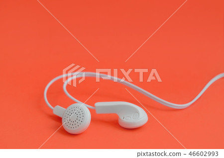 Music listening fans. White earphones on red Music listening fans. White earphones on red 46602993