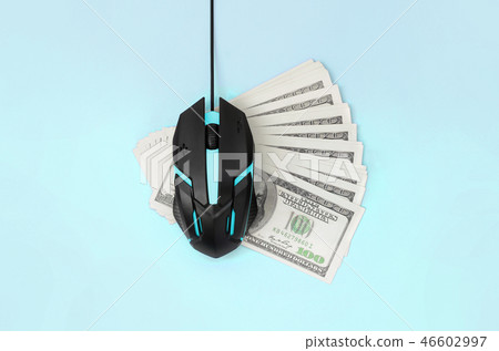 Black computer mouse on many hundred dollar bills Black computer mouse on many hundred dollar bills 46602997