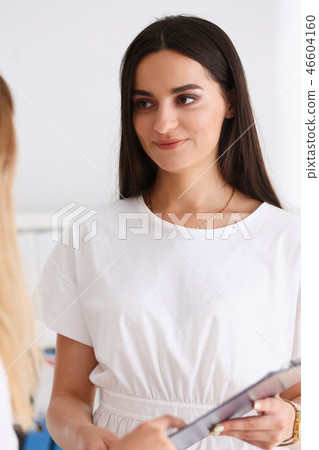 Group of people deliberate on problem clipboard 46604160