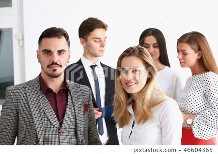 Group of smiling people stand in office 46604365