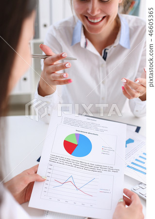 Businesswoman holding a silvery pen 46605365
