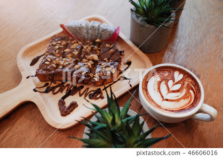 Hot Coffee on wooden table with chocolat on bread 46606016