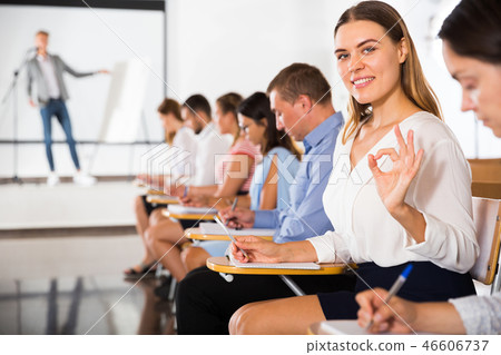 Side view of girl gesturing ok sign 46606737