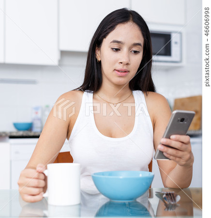 Young girl having breakfast Young girl having breakfast 46606998
