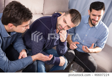 Upset friends talking on couch 46607224