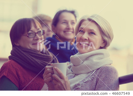 Senior women drinking tea at balcony 46607549