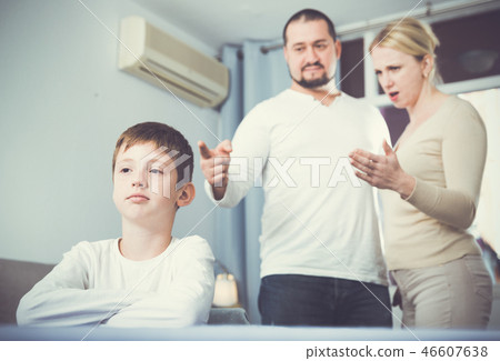 Parents berating frustrated boy 46607638