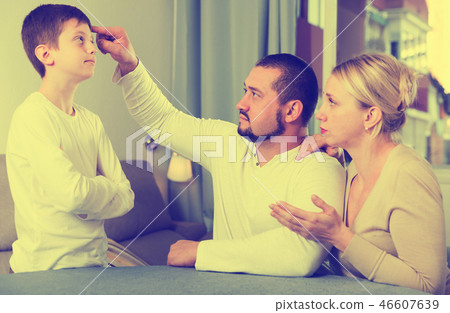 Upset parents berating son Upset parents berating son 46607639