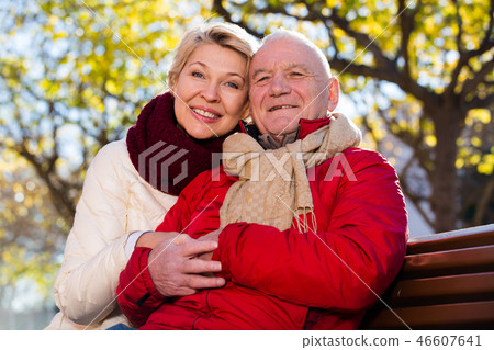 Mature couple sitting in park 46607641