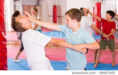 Kids exercising self-defense movements Kids exercising self-defense movements 46607842