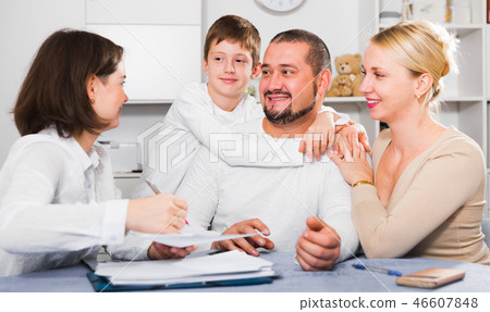 Happy family meeting financial adviser 46607848