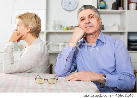 Husband and wife arguing with each other and try to resolve family conflict at table Husband and wife arguing with each other and try to resolve family conflict at table 46608146