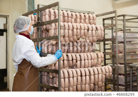 Woman with sausage trolley Woman with sausage trolley 46608295