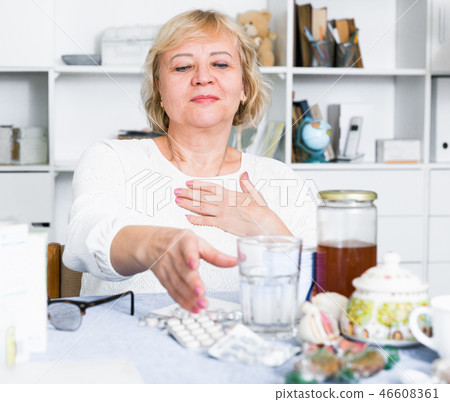 Mature woman with medicines and bills Mature woman with medicines and bills 46608361
