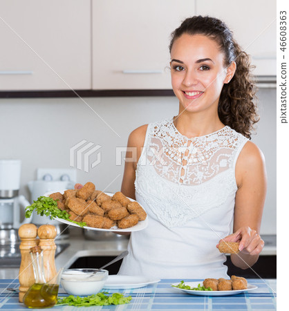 brunette with home-made croquettes brunette with home-made croquettes 46608363