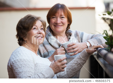 Women in pullovers on terrace 46608375