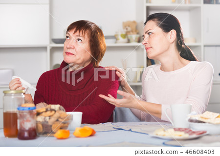 Upset mature woman quarrel with daughter sitting 46608403